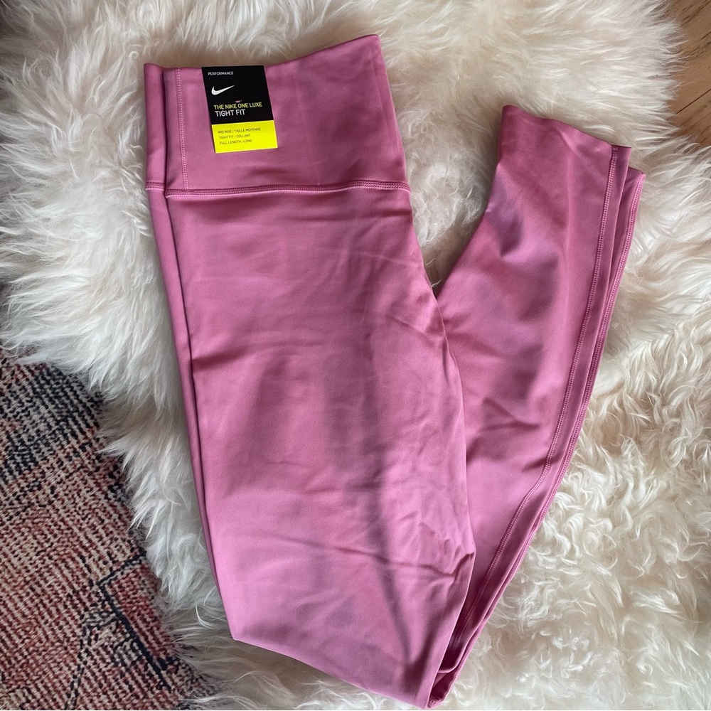 NWT. Nike One Luxe Tight fit leggings, mid-rise. Bubblegum pink. Dri-fit tech.